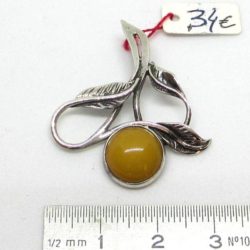 This amber pendant is on silver 925 millieme.