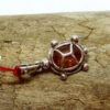 Amber and silver turtle pendant