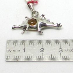 Dinosaur pendant on silver and amber