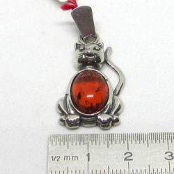 Cat pendant on silver and amber