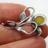 This amber pendant is on silver 925 millieme.